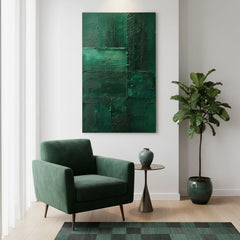 Quadro astratto verde smeraldo in soggiorno sopra la poltrona verde