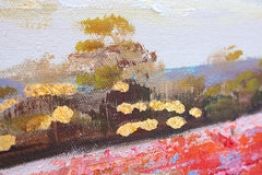 Dettaglio della pennellata sul quadro dipinto a mano con motivo campo fiorito nei toni del rosso e del verde – primo piano sugli strati di colore.
